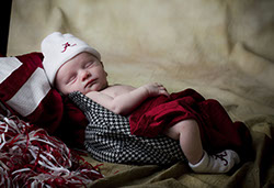 A Roll Tide kind of a picture. A baby in a houndstooth hat taken by a Tuscaloosa photographer.