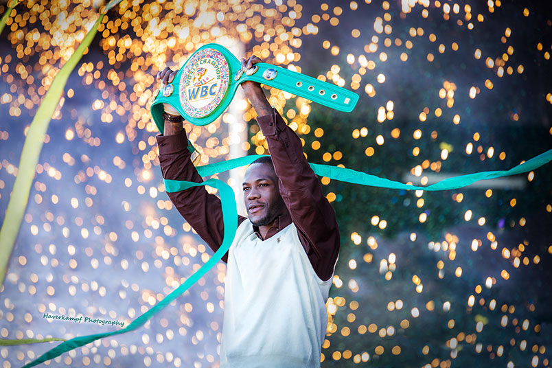 Deontay Wilder holds up the WBC Heavyweight Belt for his hometown family in Tuscaloosa, Alabama. Taken by a Tuscaloosa photographer